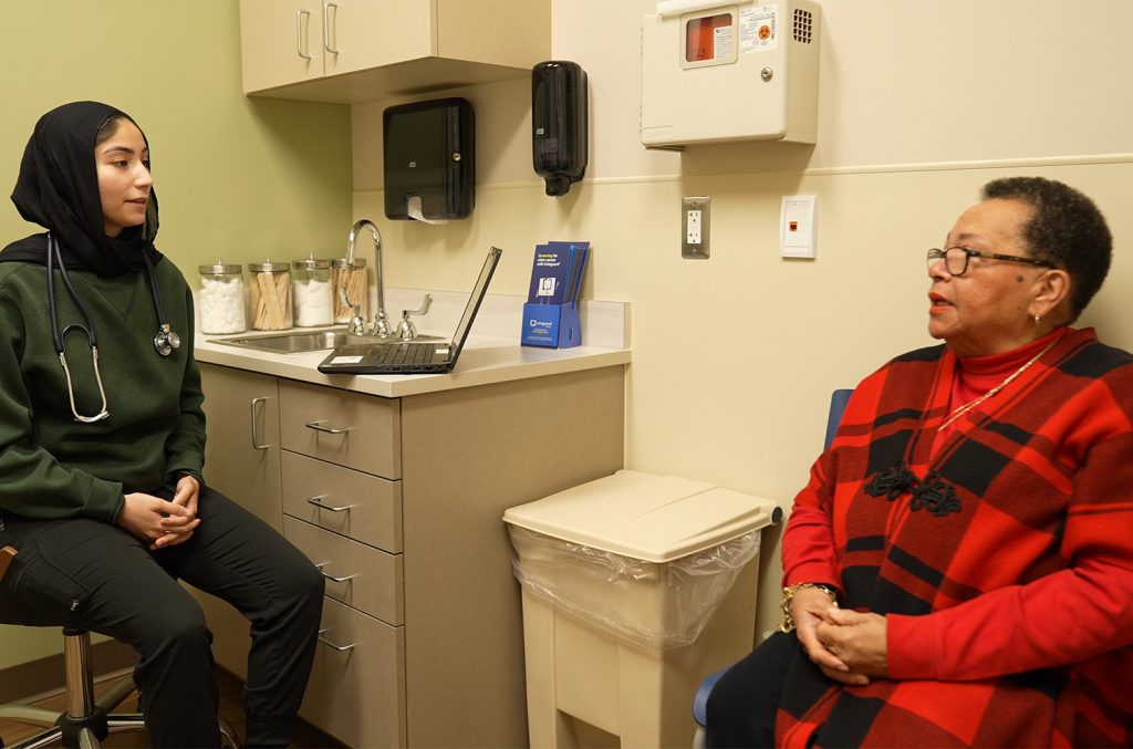 Woman talking with care provider.