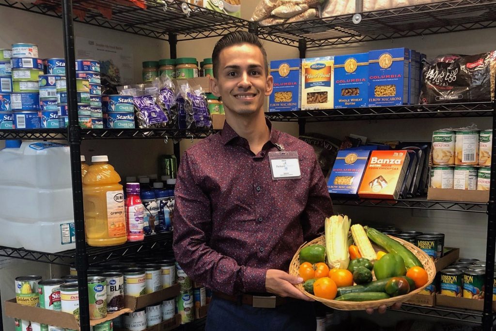 Packard Health volunteer at food pantry